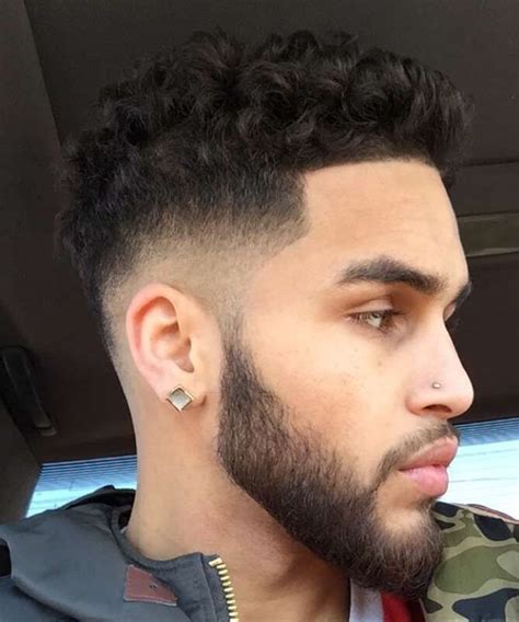 If you have thick, kinky hair, growing and styling a tall afro may be easier. If you have tight curls, a short tapered afro might look better. As part of the short sides, long top men’s hair trend, we generally recommend tapered or faded sides to highlight the cool hairstyle on top. However, some guys may want an all around afro.